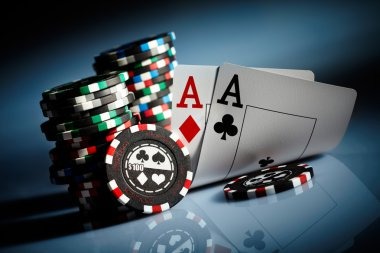 Close-up of mobile screen showing bet buttons and community card progression